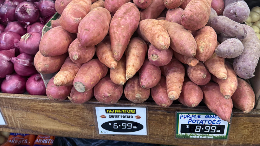 Sweet potatoes piled high on an Australian greengrocer shelf