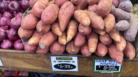 Sweet potatoes piled high on an Australian greengrocer shelf