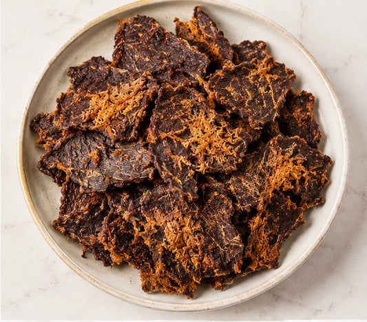 Plate of handmade dehydrated beef and carrot dog treats by Pooches Pantry