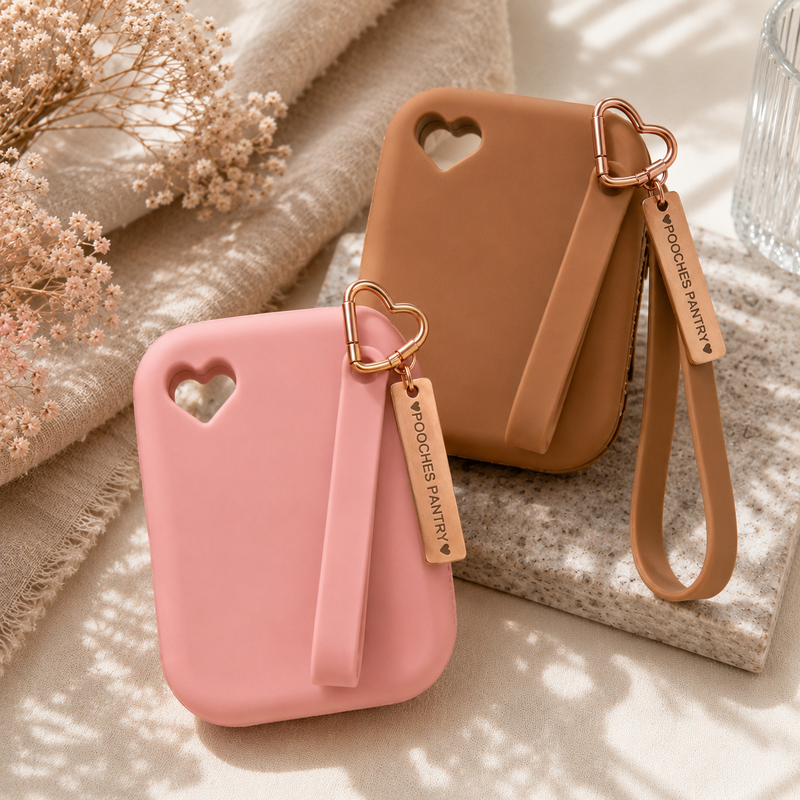 The Walk Set — pink silicone treat pouch paired with a 100g pouch of Pooches Pantry treats