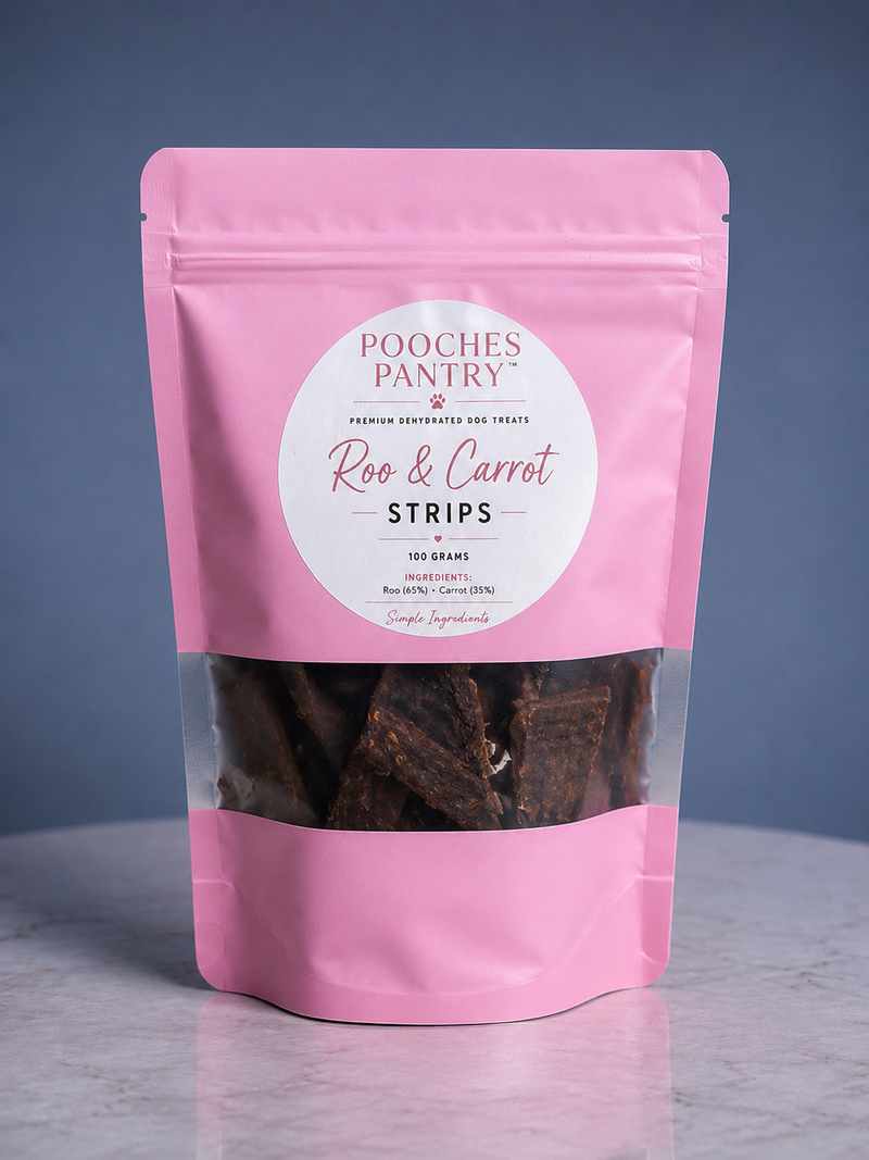 Roo & Carrot Strips dog treats in a pink Pooches Pantry pouch